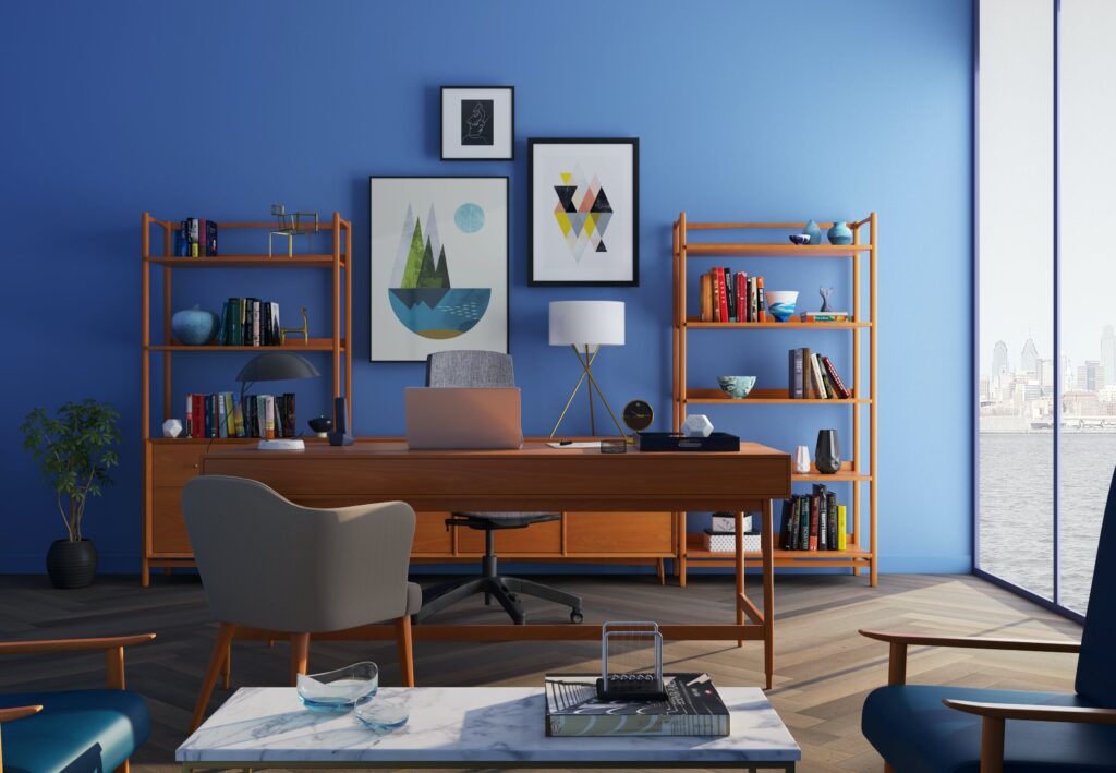 A clean and organized office with modern furniture and blue walls