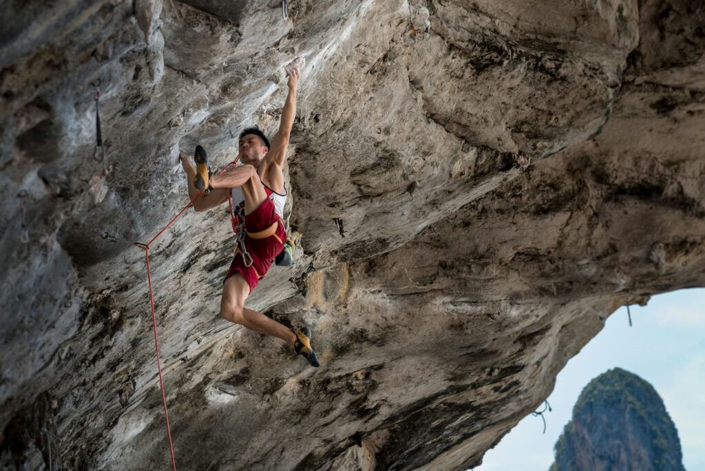 A man climbing a steep mountain