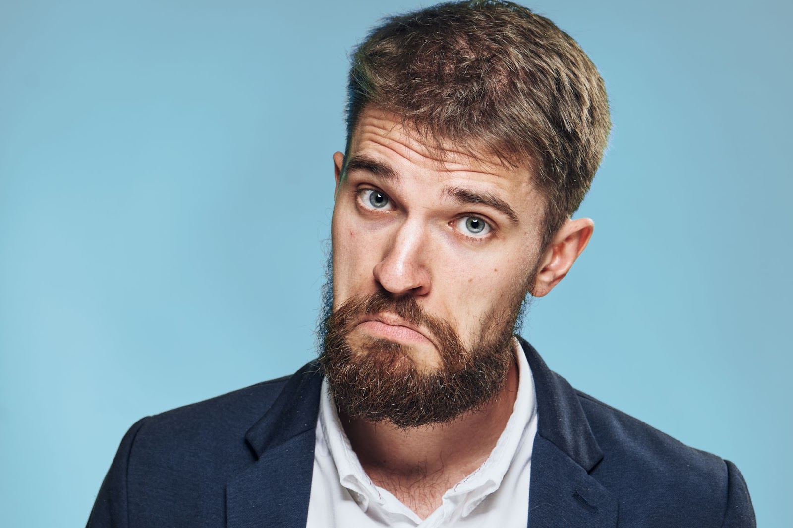 A man with a "not bad" facial expression