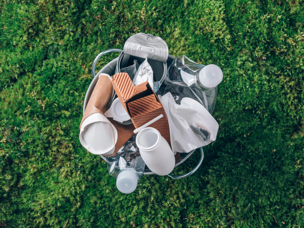 single use plastic and paper bottles, cups, and boxes