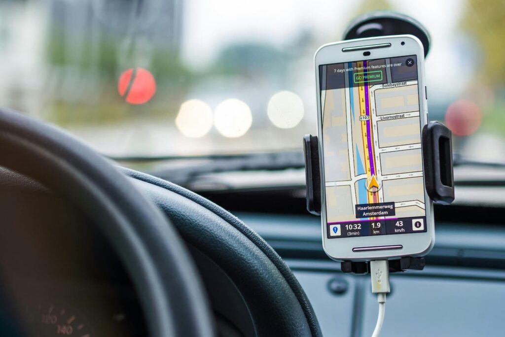 A driver's smartphone displaying the route to a destination