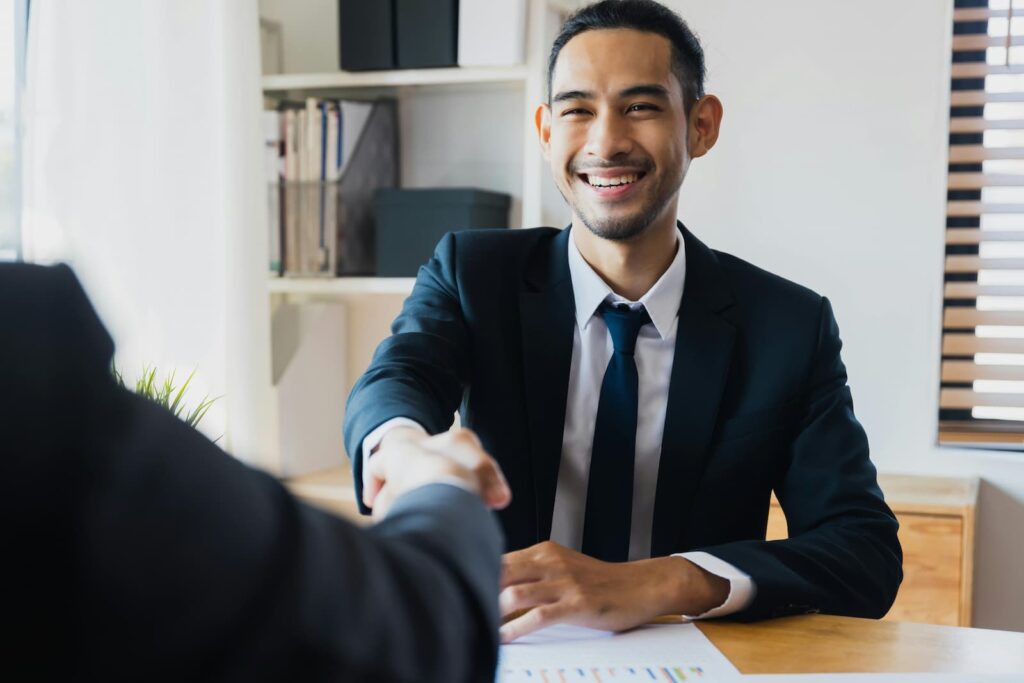 A young businessman shaking hands during a meeting