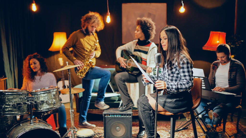 A group of people with various instruments making music