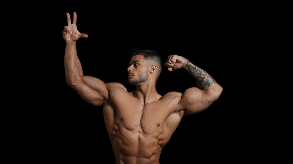 A man showing off by flexing his muscles