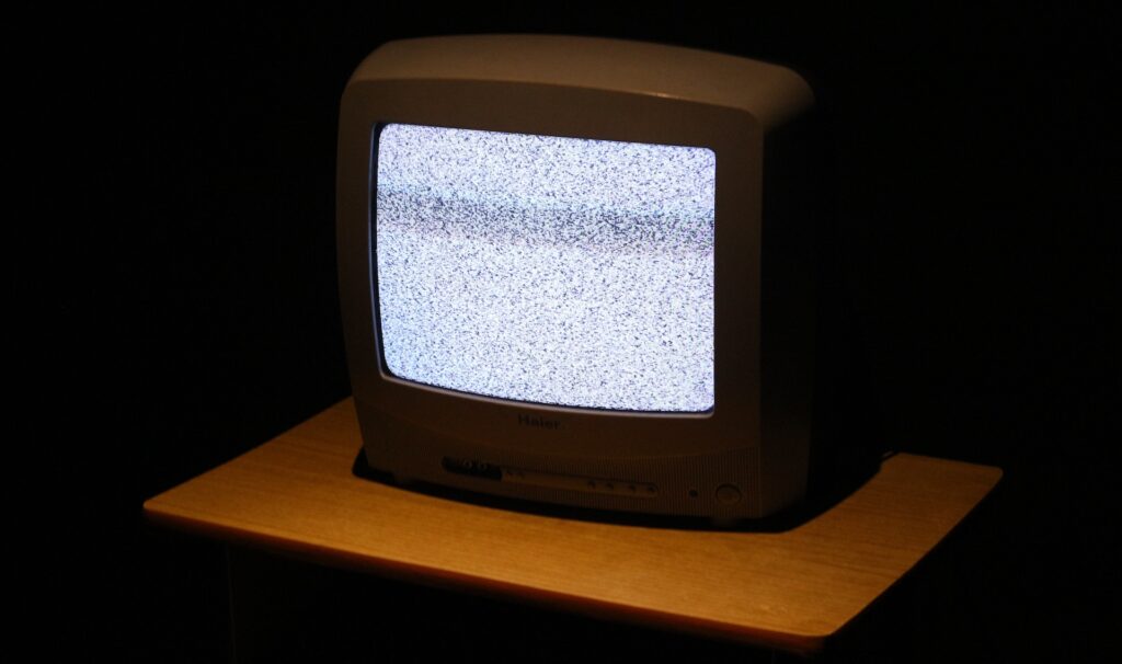 A television with a blurry image on the screen