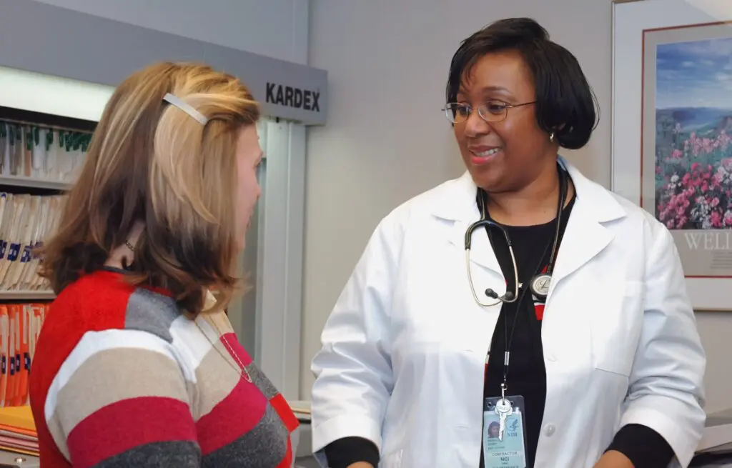 A doctor advising her patient after a checkup