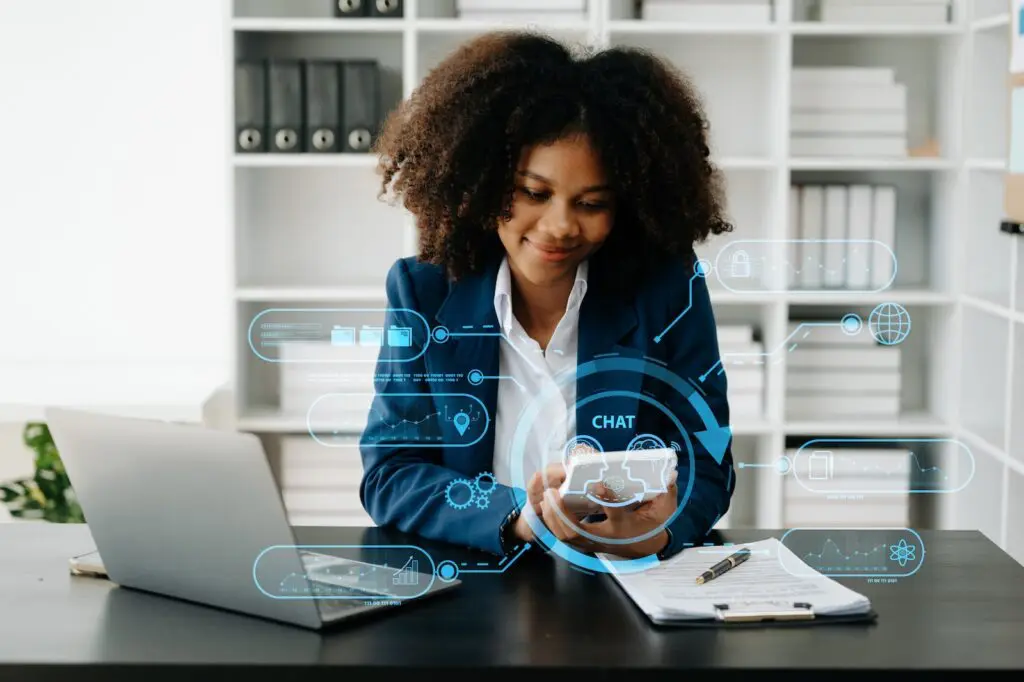 A young woman using an AI chatbot on her PC and tablet to practice learning a foreign language