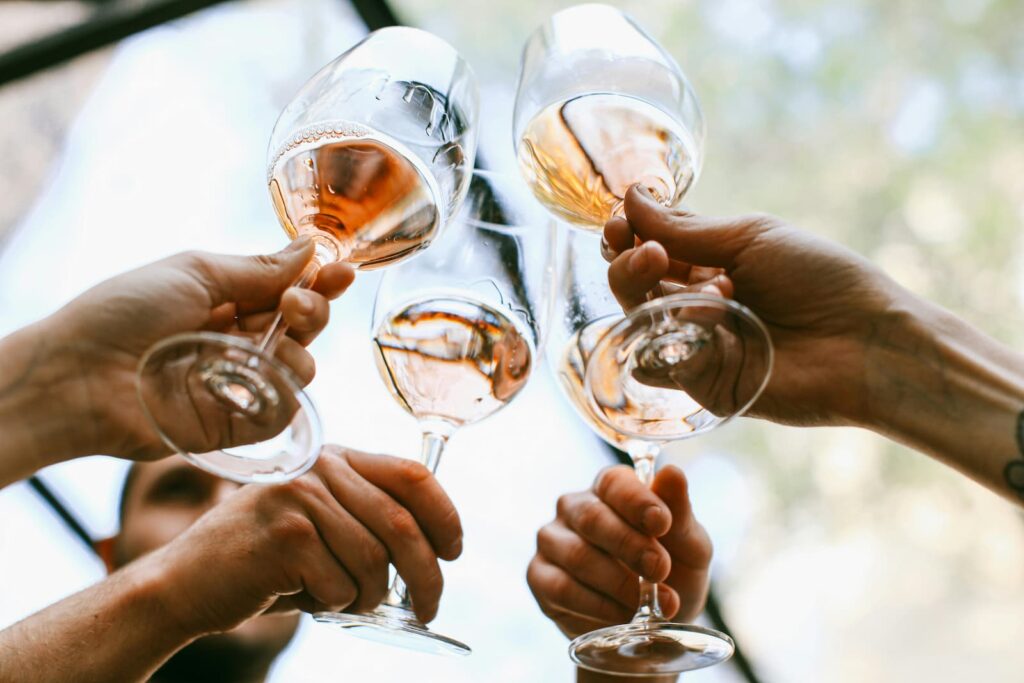 A group of people raising their glasses for a toast