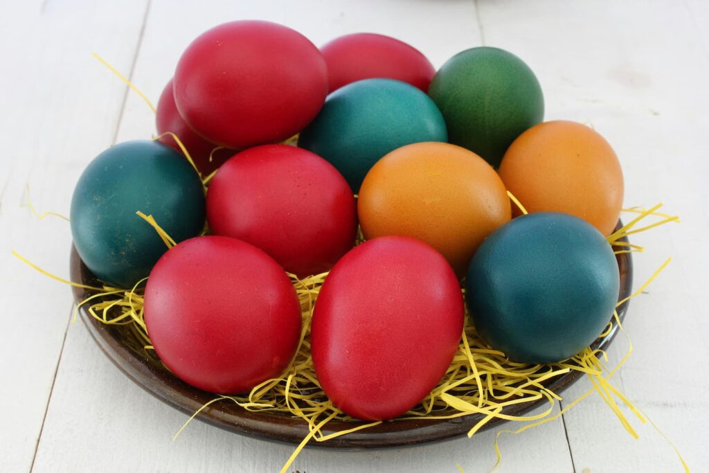 Several colorful Easter eggs in a shallow bowl