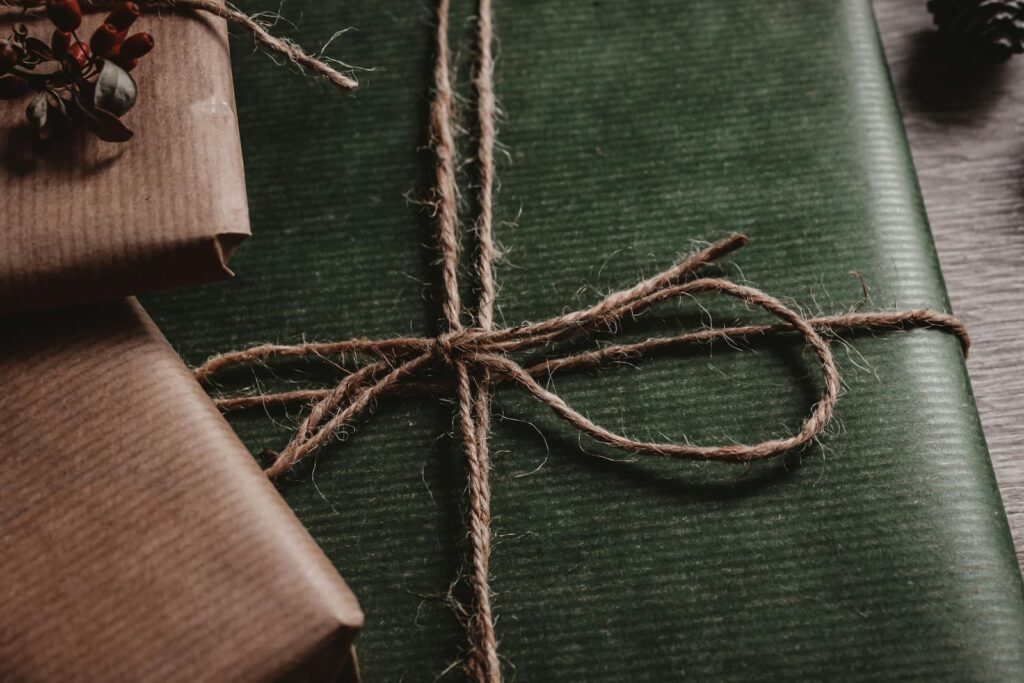 Christmas gifts wrapped in green and brown paper