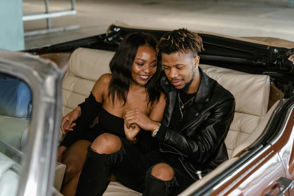 A couple sitting together in a car
