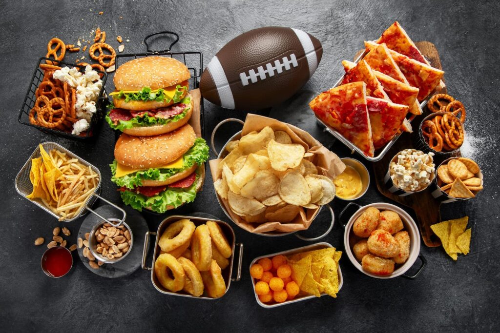Various foods and snacks prepared for a Super Bowl party