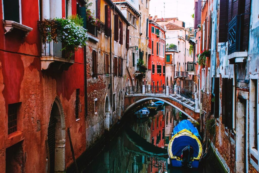 A waterway between old buildings in Italy