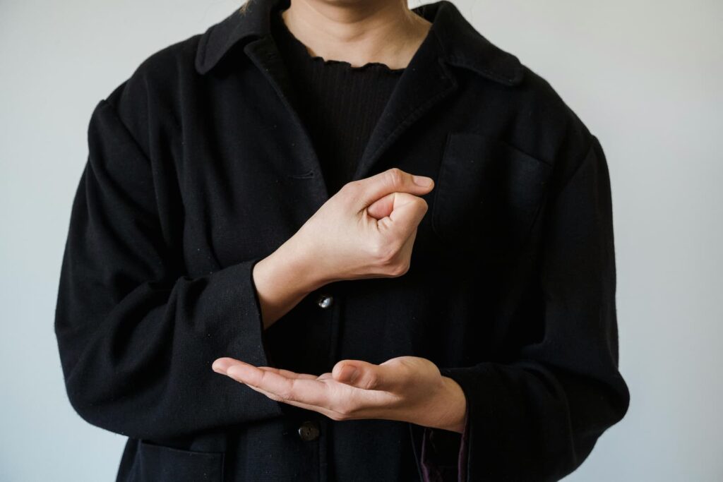 A woman doing sign language