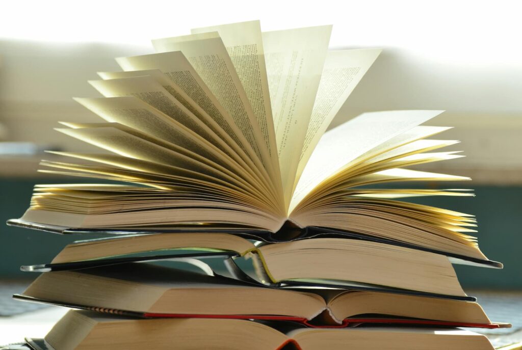 Open books stacked on top of one another