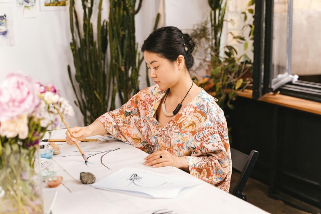 A woman painting in an art studio